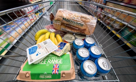 Own-brand items, including eggs, bread, cheese and bananas in a shopping trolley inside a Morrisons supermarket