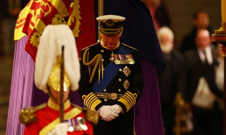 King Charles stands at the head of his mother’s coffin at a vigil in Westminster Hall on Friday.
