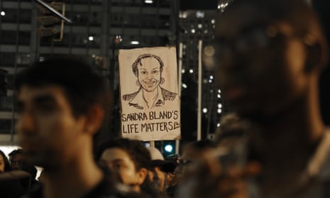 A demonstrator holds a Sandra Bland sign during a vigil in Chicago, Illinois, on 28 July 2015. 