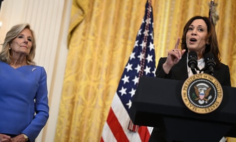 US vice president Kamala Harris speaks during a reception honoring Women's History Month in the East Room of the White House in Washington, DC, March 18, 2024, with Jill Biden (left) listening.