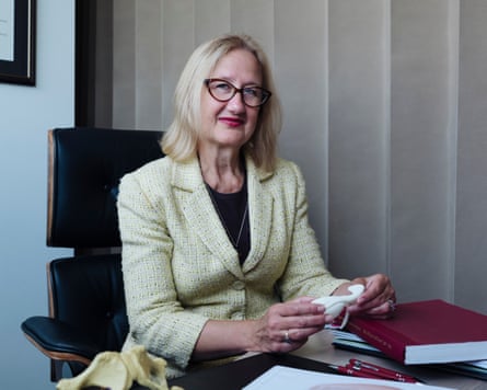 Helen O'Connell, Australia's first female urological surgeon wearing a overgarment and sitting astatine a desk
