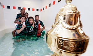 Feyenoord’s players take to the bath to celebrate their KNVB Cup win.