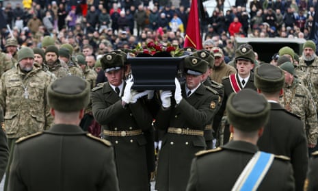 Servicemen carry Dmytro Kotsiubailo’s coffin during his memorial service in Kyiv