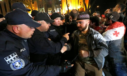 Police officers scuffle with counter-protesters during the rally against the government’s anti-drug policy in Tbilisi on 13 May.