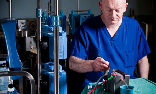 Mike Nicholson, professor of transplant surgery at the University of Cambridge, working on a perfusing kidney.