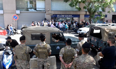 Lebanese soldiers stand guard outside of the Blom branch in Beirut, Lebanon, on Wednesday.