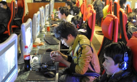 Young men play online games at an internet cafe in Beijing in 2010. Due to economic and cultural reasons, home consoles are still a hard sell in China.