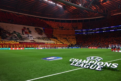 Galatasaray fans display a family themed tifo alongside some fervent flag waving.