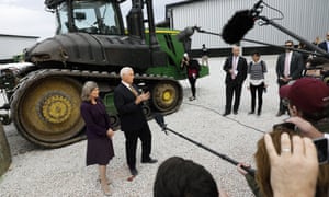 Senator Joni Ernst and Vice-President Mike Pence speak to reporters during a visit to the Manning Farms, on Wednesday in Waukee, Iowa.