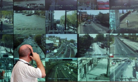 A Metropolitan police officer watches a bank of monitors showing images from London’s CCTV camera network.