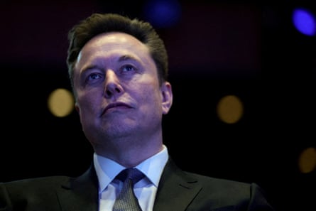 Elon Musk in a suit and tie