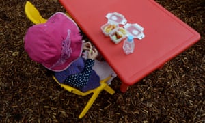 A young child eats her morning tea at a preschool in Canberra