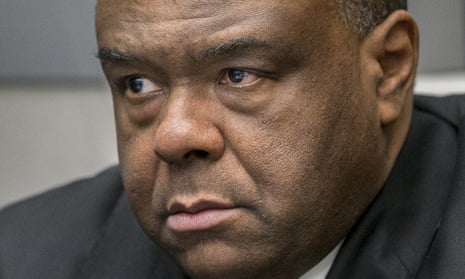 Jean-Pierre Bemba takes his seat in court room on Monday. The former Congolese vice-president was arrested in Belgium in 2008.