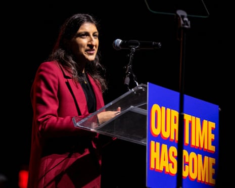 a woman speaks into a microphone