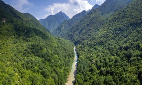 A river running in a gorge between forested mountains.