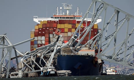 Crushed shipping containers are seen on the bow of the Dali after it struck the Francis Scott Key Bridge, on 29 March 2024 in Baltimore, Maryland. 