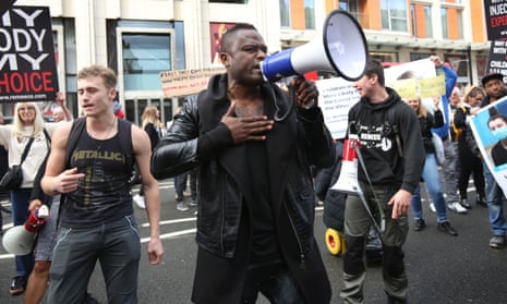 Rapper Remeece, whose music was on Spotify, at an anti-vaccine rally in October 2021