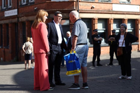 Burnham and Rayner speaking to a member of the public.