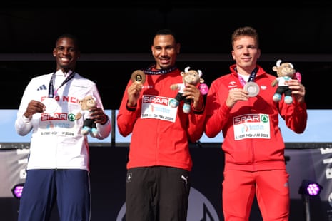 Jason Joseph of Team Switzerland (centre), the silver medalist Just Kwaou-Mathey of France (left) and bronze medalist Jakub Szymanski of Poland.