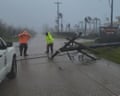A utility pole blocks a road in Saipan after a super typhoon hit the Northern Marianas.
