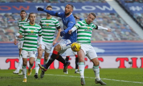 Kemar Roofe of Rangers battles with Leigh Griffiths of Celtic.