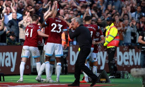 West Ham’s Marko Arnautovic celebrates scoring his side’s third goal while Manchester United manager Jose Mourinho cuts a frustrated figure.