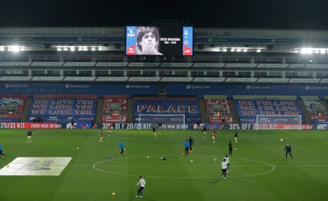 An image of a young Diego Armando Maradona is shown on the big screen as the players warm up at Selhurst Park.