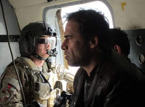 Agence France-Presse photographer Shah Marai sits in a helicopter with a member of the International Security Assistance Force while on assignment in Afghanistan in 2013.
