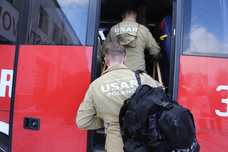 Firefighters prepare to depart from Łódź in Poland to undertake rescue operations in Turkey.