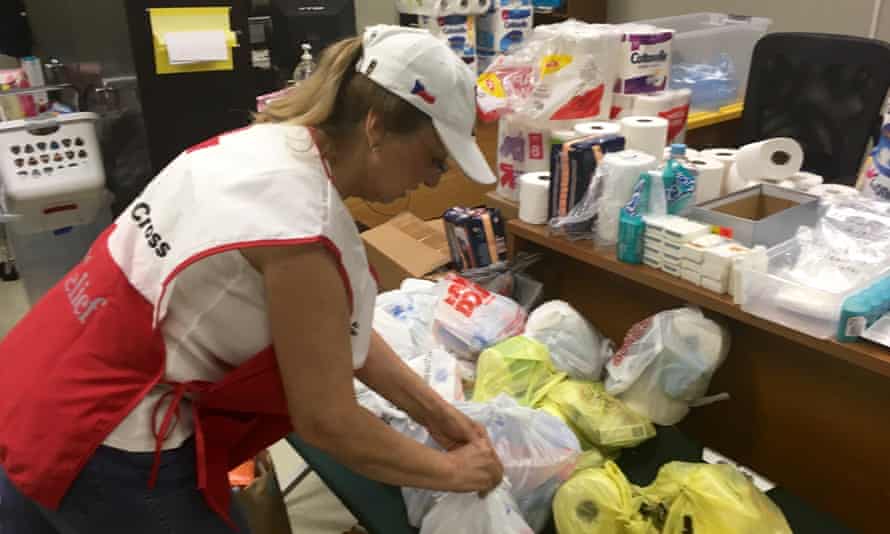 Liz Bemtivegna assembles kits of necessities at a Red Cross shelter.