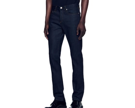 A cropped at waist image of a model wearing Sandro Waterless narrow cut jeans