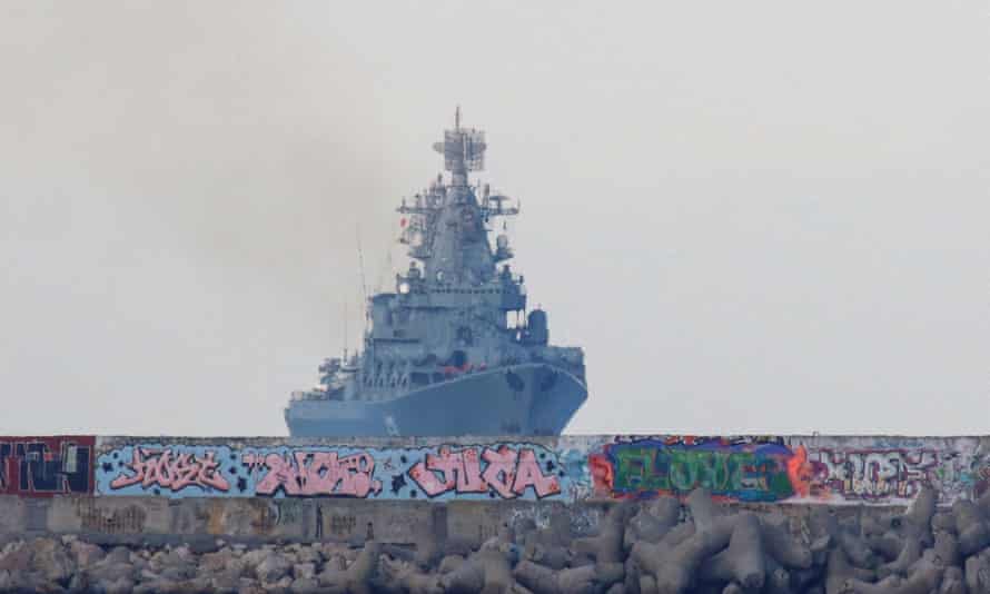 As it was: Russian Navy’s guided missile cruiser Moskva (Moscow) behind a wave breaker and an embankment, as it sails back into a harbour after tracking NATO warships in the Black Sea, in the port of Sevastopol, Crimea, November 16, 2021.