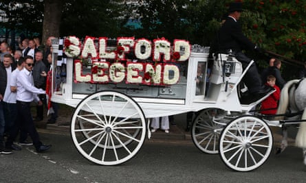 Mourners attend the funeral procession of Paul Massey in Salford, Manchester.