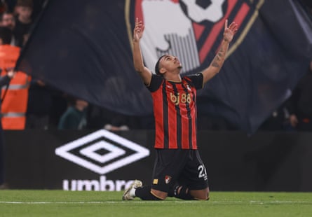 Eli Junior Kroupi puts his arms up in delight after his equaliser