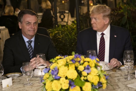 President Donald Trump, right, and Jair Bolsonaro, then Brazil's president, during a dinner at Mar-a-Lago resort in Palm Beach, Florida, on Saturday, 7 March 2020.
