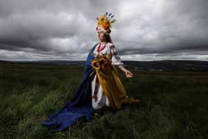 Portrait, winner - Olha Boyko, 36, wearing a traditional embroidered dress and vinok (wreath), and draped in the Ukrainian flag on 25 July to mark Independence Day