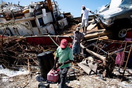 People recover items from a beached boat after Hurricane Dorian in Marsh Harbour on Thursday.