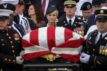 Cindy McCain looks on as military personel carry the casket of the late Senator John McCain.