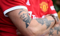 A Manchester United displays a Sir Alex Ferguson tattoo before the crushing defeat by Liverpool last Sunday.