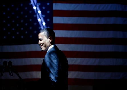 A shaft of light falls on Democratic presidential candidate Barack Obama, smiling in front of the American flag, following a rally at the American GI Forum in San Antonio, Texas, March 3 2008