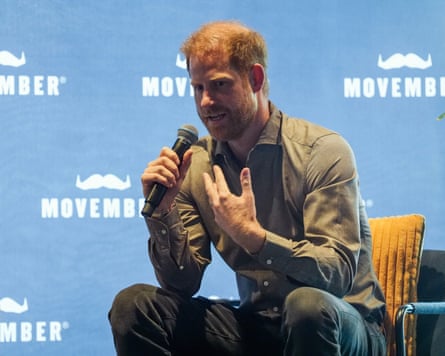 Prince Harry speaks into microphone