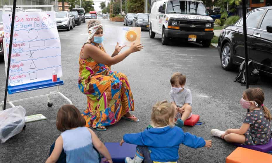 A teacher reads a book to incoming pre-kindergarten students in Brooklyn, New York, on 2 September 2020.