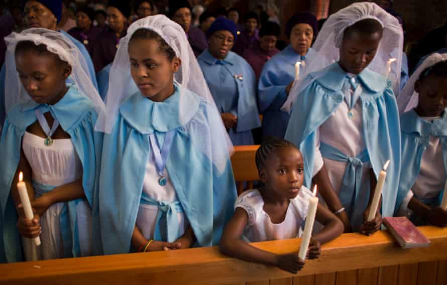 On 8 December 2013, young members of the choir attend a memorial for Nelson Mandela, who died 3 days earlier, at the Regina Mundi church, which became one of the focal points of the anti-apartheid struggle, in Soweto, Johannesburg, South Africa. 8 December.