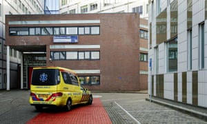 An ambulance pulls into UMC Utrecht, a university hospital in the Netherlands where one of the two Dutch doctors were transferred