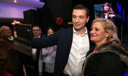 Jordan Bardella takes a selfie with Le Pen supporters at a March meeting in Cogolin, southern France