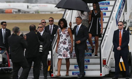President Barack Obama and his family walk down the stairs as they arrive in Havana, Cuba.