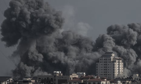 Israel-Hamas war live: White House promises ‘continued flow’ of Gaza aid as Israel steps up airstrikes in north of strip | Israel-Hamas war 6 Smoke rises in Gaza City after Israeli airstrikes on Sunday.