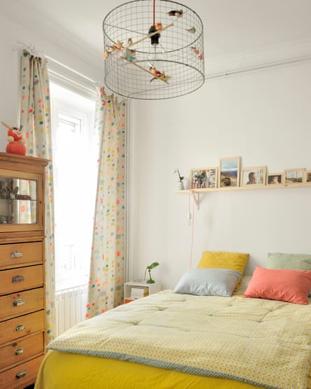 Sweet dreams: sunshine yellows and a homemade lampshade in Chloé and Thomas’s bedroom.