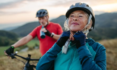 Two people on a bike ride in autumn nature