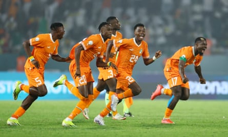 Ivory Coast players celebrate winning the penalty shootout